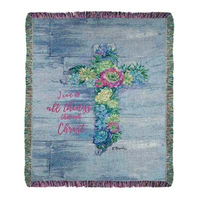 Religious throw blanket with floral cross design and inspirational text on a blue wood-look background