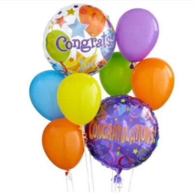Cluster of colorful congratulatory balloons with two printed message balloons