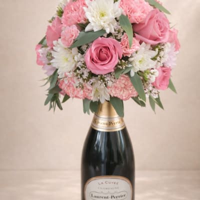 Pink and white bouquet arranged on a champagne bottle