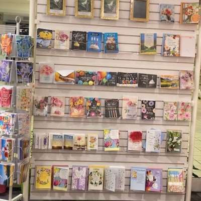 Greeting cards displayed on a store rack.