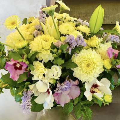 Yellow and white mixed bouquet in a glass vase