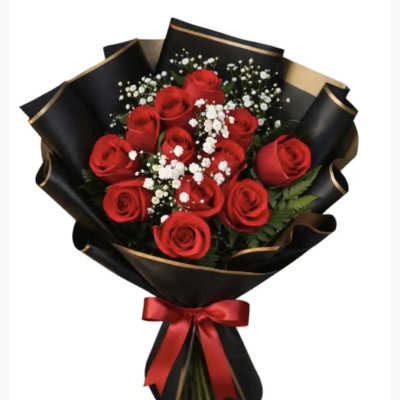 Bouquet of red roses with baby's breath in black and gold wrapping