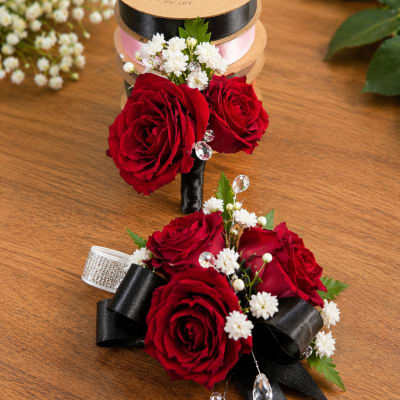 Crimson elegance corsage and boutonniere