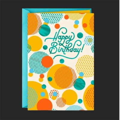 Birthday greeting card with colorful polka dots and a turquoise envelope
