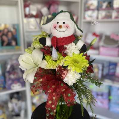 Holiday bouquet with a plush snowman and red ribbon