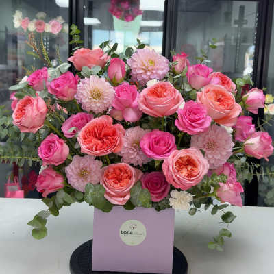 Pink and peach rose bouquet in a lavender box
