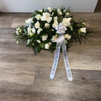 FUNERAL CASKET WITH VARIETY OF FLOWERS IN WHITE COLOR AND PERSONALIZED RIBBON