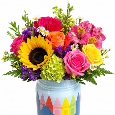 Colorful mixed bouquet in a painted blue jar vase