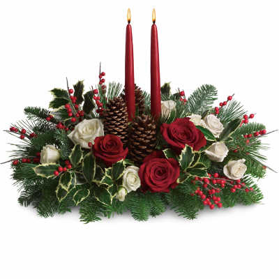 Christmas centerpiece with red candles, roses, pinecones, and evergreen branches