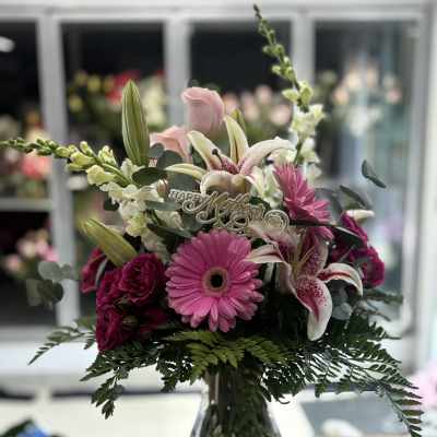Pink and white mixed bouquet in a clear glass vase