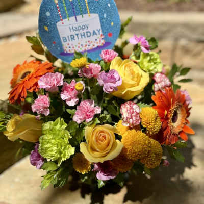 Birthday bouquet with yellow roses, orange gerberas, and pink carnations