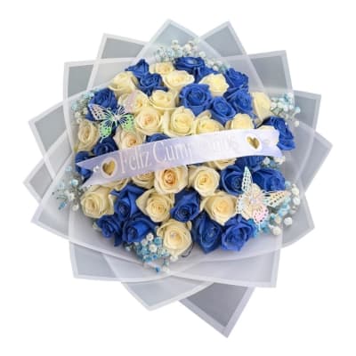 Blue and cream rose bouquet with a birthday ribbon and butterfly decorations