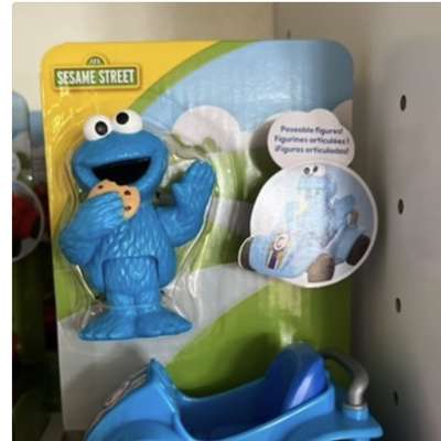 Sesame Street Cookie Monster toy in a blue kart package