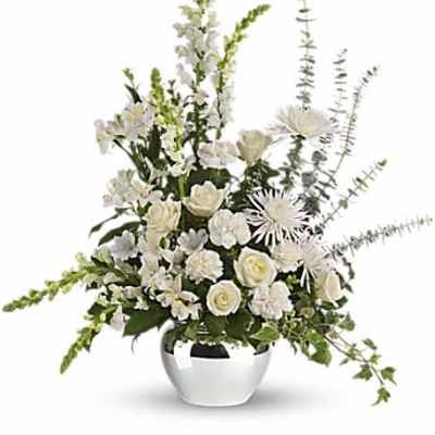 White floral arrangement in a silver vase with tall stems