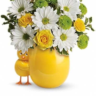 Yellow vase with daisies and roses, plus a small chick figurine