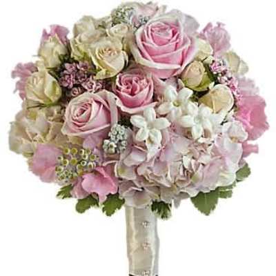 Round bridal bouquet of pink and ivory roses with white blooms, wrapped in ivory satin ribbon.