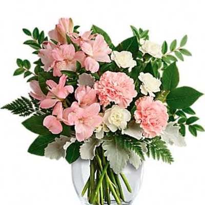 Pink and white carnation and alstroemeria bouquet arranged in a clear glass vase