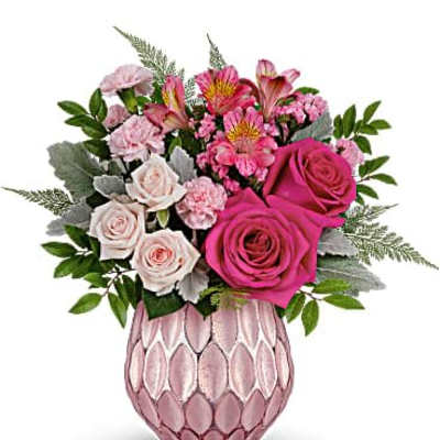 Pink and blush roses, carnations, and alstroemeria in a textured pink vase