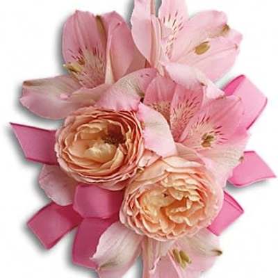 Pink corsage with peach roses and pink alstroemeria accented by pink ribbon