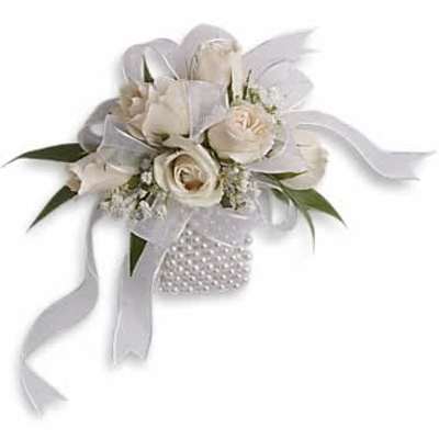 White rose wrist corsage with ribbons on a pearl-beaded band