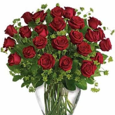 Large arrangement of red roses in a clear glass vase
