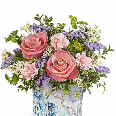 Pink roses and carnations in a decorated glass vase
