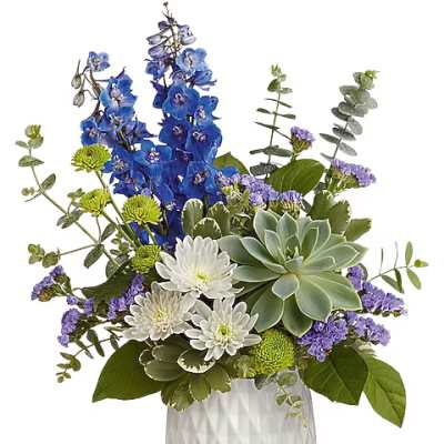 Blue and white floral arrangement with a succulent in a white vase