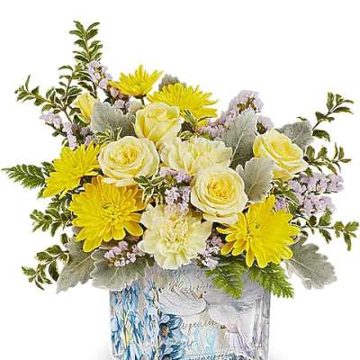 Yellow and cream bouquet in a decorative glass vase
