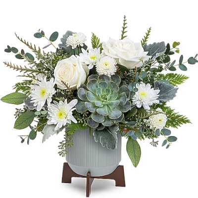 White roses and daisies arranged with a succulent in a gray vase