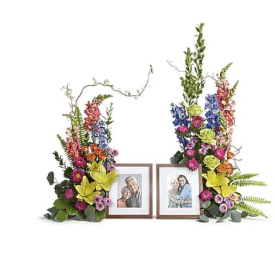 Two floral sprays framing two photo frames