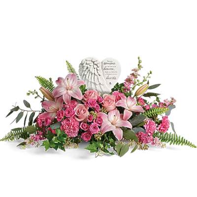 Pink floral arrangement with a heart-shaped memorial stone