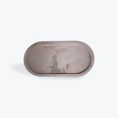 Empty oval metal tray on a white background