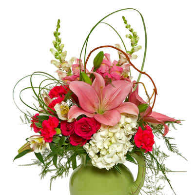 Pink lilies and red roses in a green vase