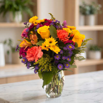 Colorful mixed bouquet in a clear glass vase