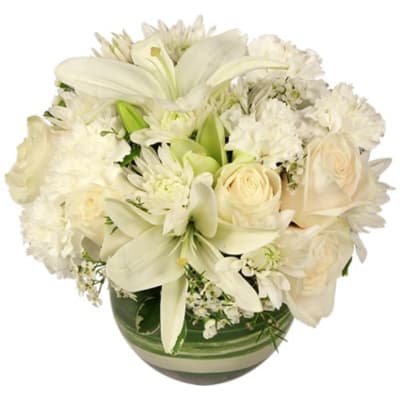 White lilies and roses arranged in a green striped vase