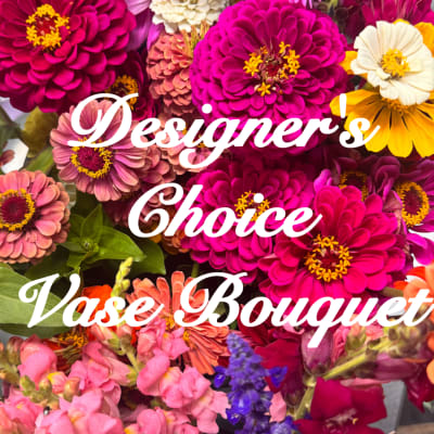 Mixed bouquet of bright zinnias and snapdragons with bold pink and yellow blooms