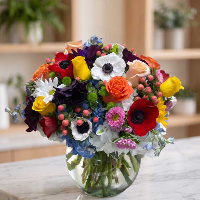 Colorful mixed bouquet in a clear glass vase