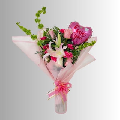 Pink bouquet with lilies, roses, and a heart-shaped "love you" balloon