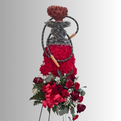 Red floral hookah-shaped arrangement above a bouquet of red roses and carnations