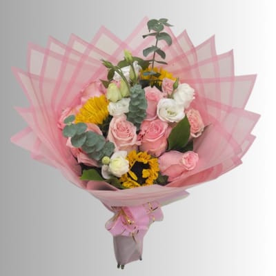 Pink and white rose bouquet with yellow flowers wrapped in pink paper