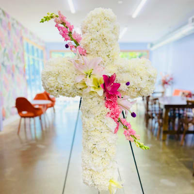 White floral cross with pink lilies and snapdragons