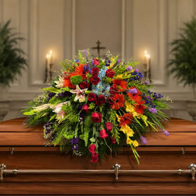 Renoir’s Touch of Vibrancy Casket Piece by Petal Perfection Flower Company