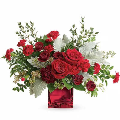 Red roses and carnations in a red glass vase