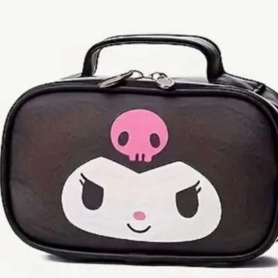 Black cosmetic bag with a cartoon face and pink skull graphic