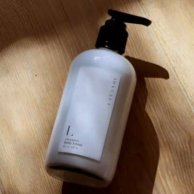Bottle of lavender body lotion on a wooden surface