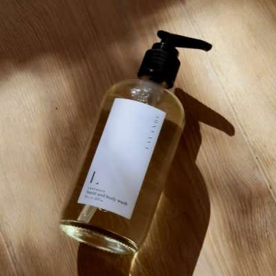 Bottle of hand and body wash on a wooden surface