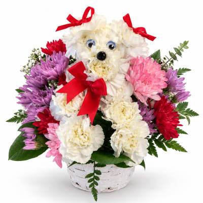 Basket of flowers arranged as a teddy bear with red bows