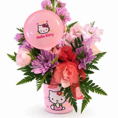 Pink and purple flower arrangement with a Hello Kitty balloon in a pink container