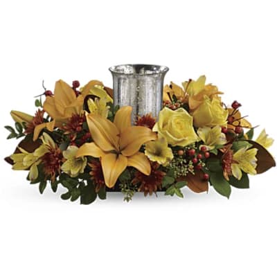 Yellow floral centerpiece around a silver vase