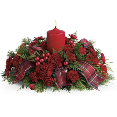 Red candle centerpiece with red flowers and plaid ribbon